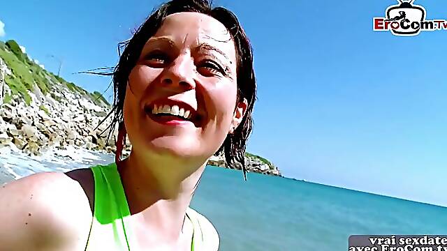 French woman is having casual sex on the beach with a younger guy she has just met