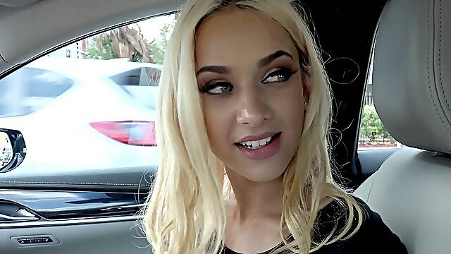 Scantily clad blonde beauty sucks a cock in the car